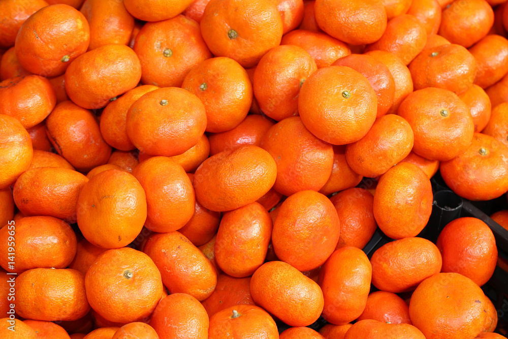 orange ripe clementines for sale at the greengrocer