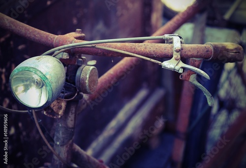 rusty bicycle with headlight photo