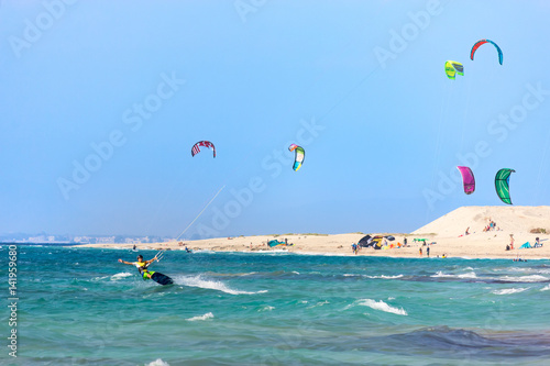 Kitesurfers on the Milos beach in Lefkada island, Greece.