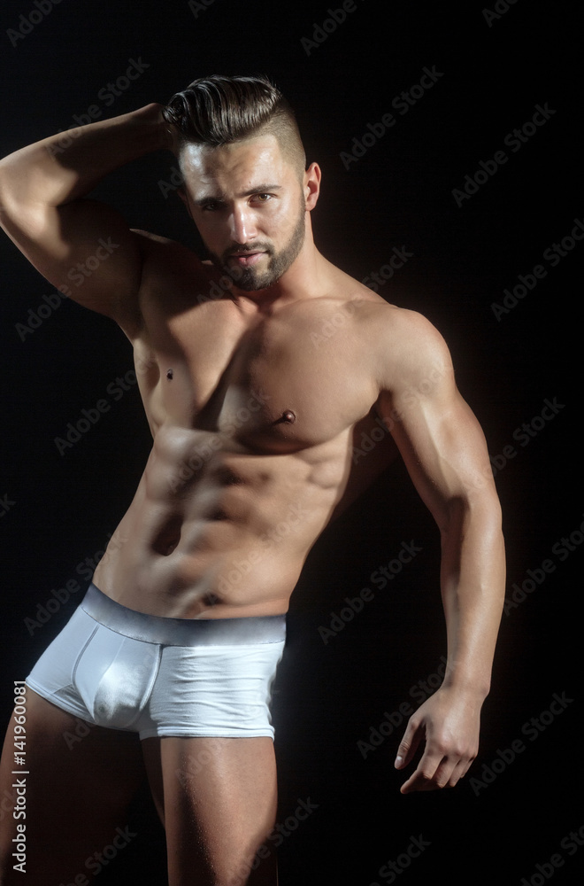 handsome muscular macho man with sexy athlete body in pants