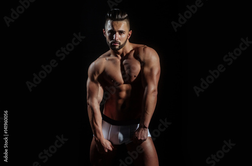handsome muscular macho man with sexy athlete body in pants © Volodymyr
