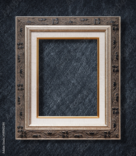 The antique frame on Dark grey black slate background or texture.