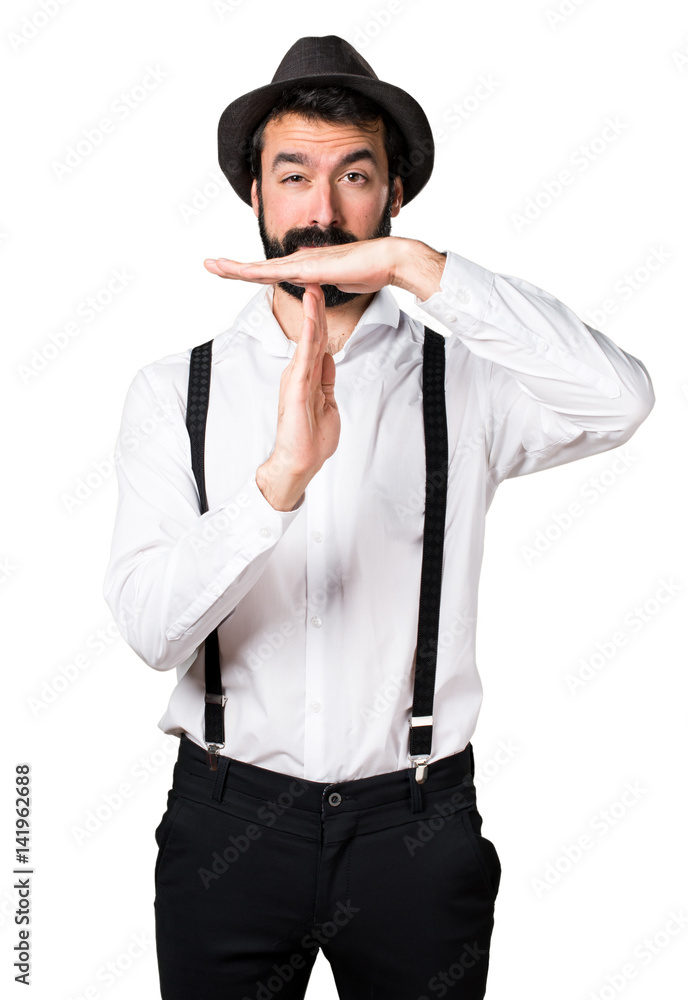 Hipster man with beard making time out gesture Hipster man with beard making time out gesture