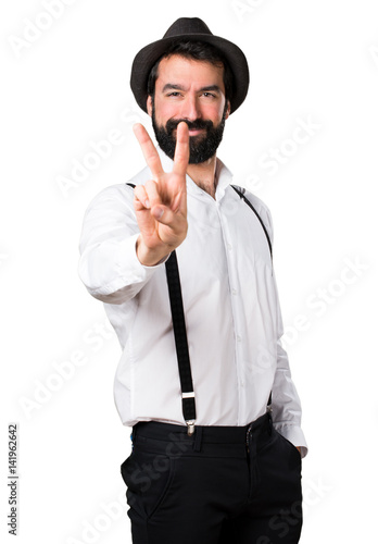 Hipster man with beard counting two