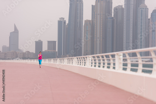 woman running on the promenade