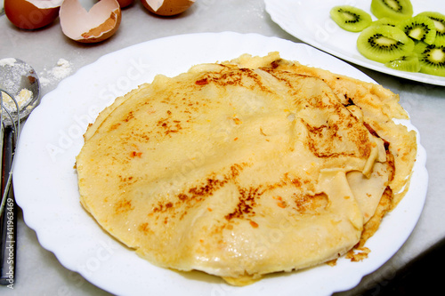 crepes and pancakes freshly made on the plate photo