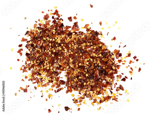 pile crushed red pepper, dried chili flakes and seeds isolated on white background, top view 
