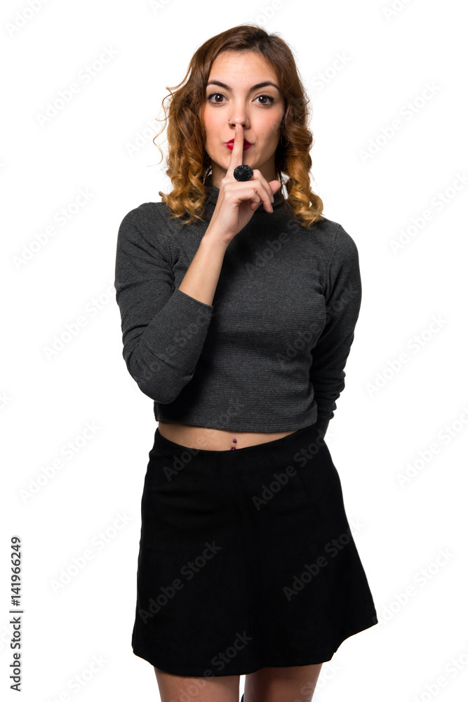 Beautiful young girl making silence gesture Beautiful young girl making silence gesture