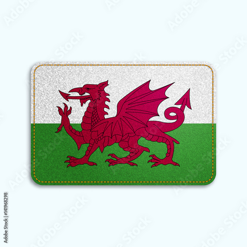 National flag of Wales with denim texture and orange seam. Realistic image of a tissue made in vector illustration.