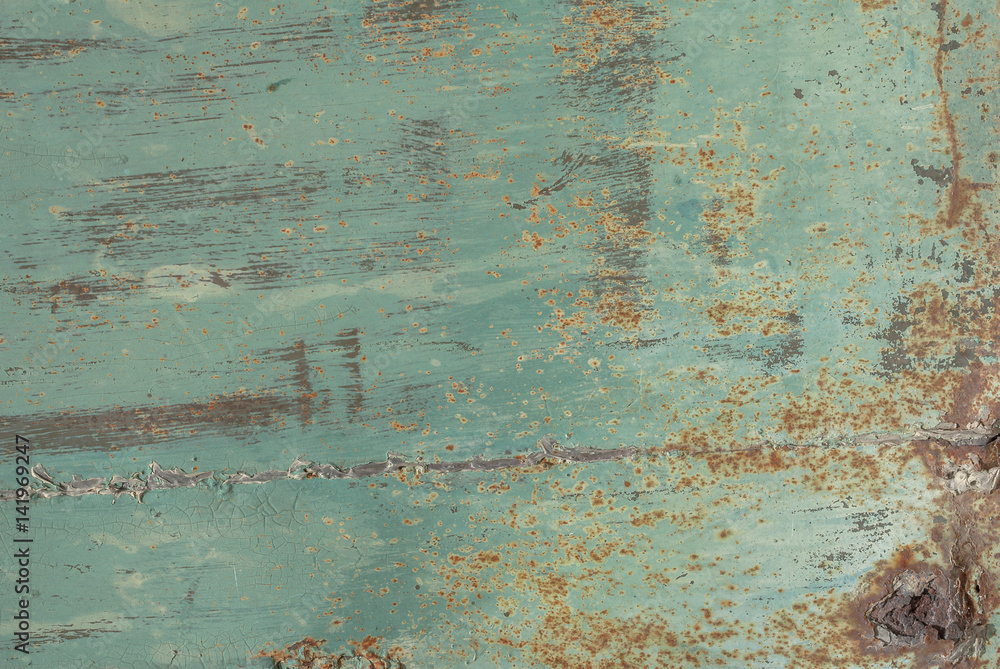 surface of rusty iron with remnants of old paint texture background