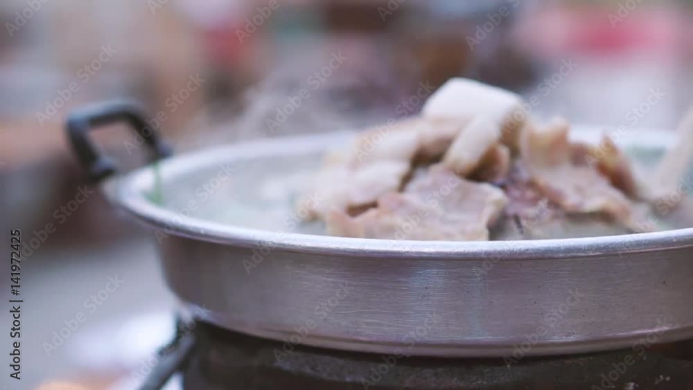 Thai common buffet, grill pork or barbecue on hot pan with vegetables and many foods Thai common buffet, grill pork or barbecue on hot pan with vegetables and many foods
