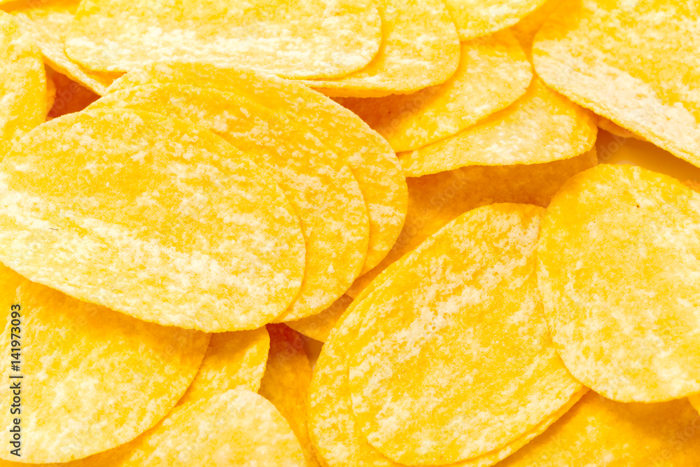 yellow potato chips isolated on white yellow potato chips isolated on white
