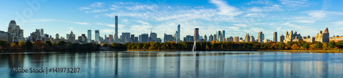 Morning panoramic view of Midtown Manhattan skyscrapers and the Central Park Reservoir in Fall. New York City
