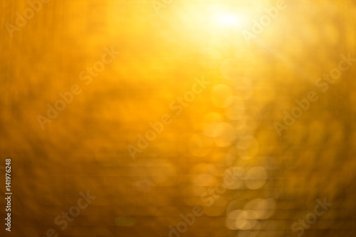 the Abstract blur golden bokeh lighting from glitter texture