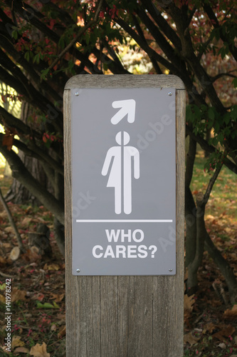 Gender neutral restroom sign that says, WHO CARES?