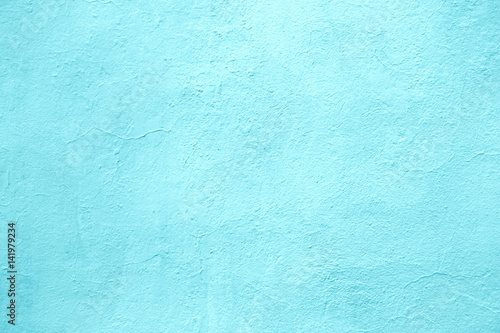 concrete wall of light blue color, texture turquoise cement background photo