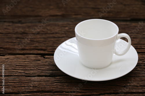 White coffee cup on old wood table. copyspace for your text