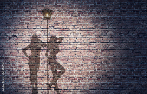 shadow of two prostitutes on the brick wall