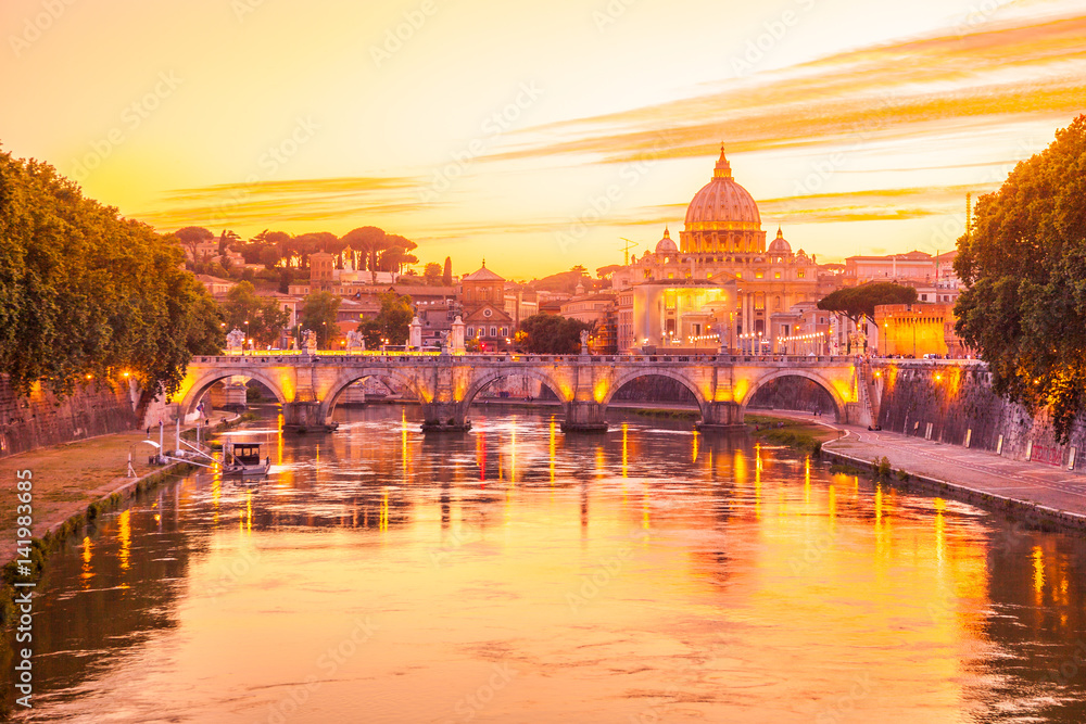 Sunset on Rome with San Pietro basilica, Sant'Angelo bridge and Tevere river in Roma, Italy