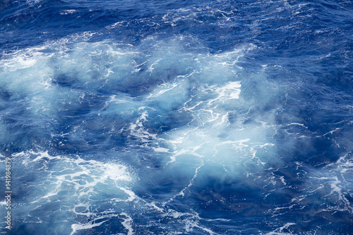 Foaming bubbles in the azure deep ocean
