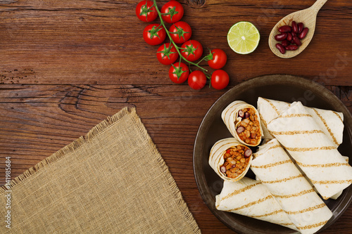 Tableau sur toile Burritos wraps with meat, beans and vegetables.