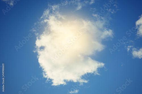 Fototapeta Naklejka Na Ścianę i Meble -  Sun and clouds against a blue sky