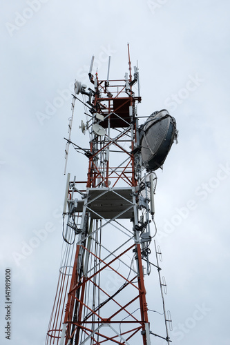 Communication antenna tower with sky background