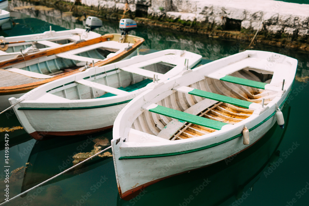 Wooden boats on the water. In the Bay of Kotor in Montenegro. Marine boats.