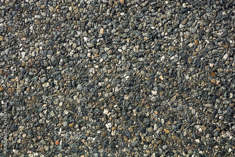 The texture of asphalt with small stones The texture of asphalt with small stones