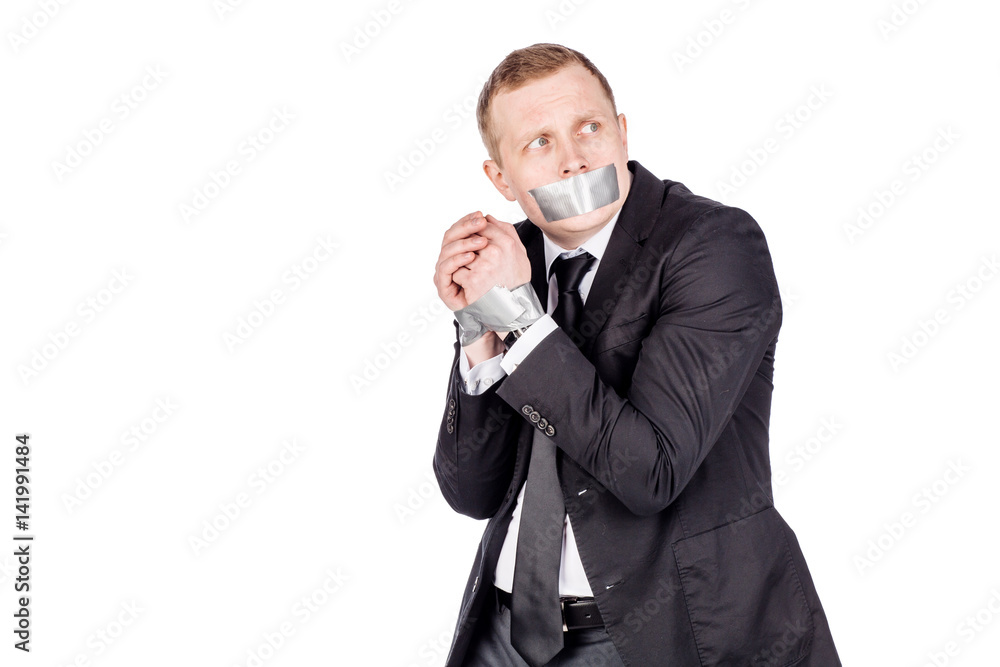 businessman with adhesive tape on his mouth and hands. . businessman with adhesive tape on his mouth and hands. .