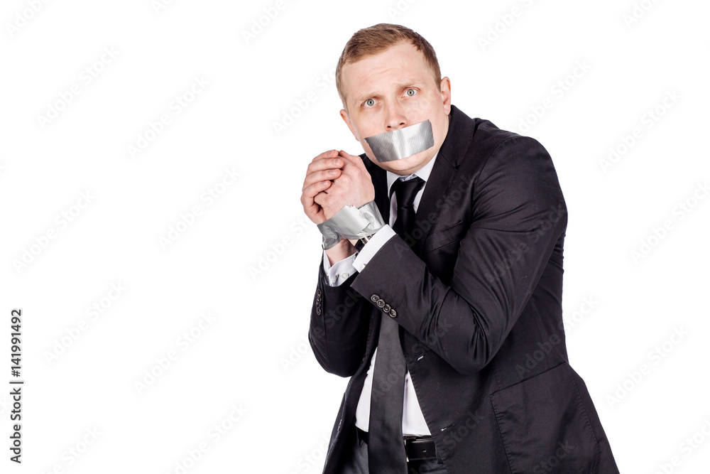 businessman with adhesive tape on his mouth and hands. . businessman with adhesive tape on his mouth and hands. .