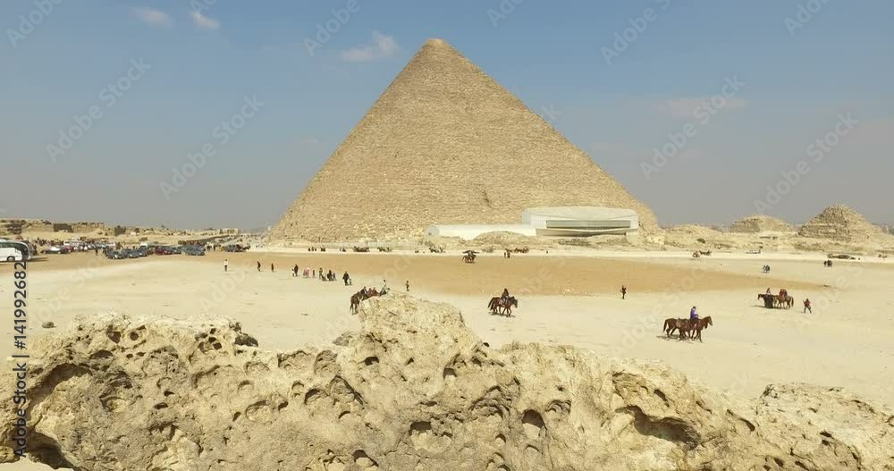 CAIRO, EGYPT - FEBRUARY 04, 2016: View of Great pyramid of Giza, also known as Pyramid of Khufu or the Pyramid of Cheops CAIRO, EGYPT - FEBRUARY 04, 2016: View of Great pyramid of Giza, also known as Pyramid of Khufu or the Pyramid of Cheops
