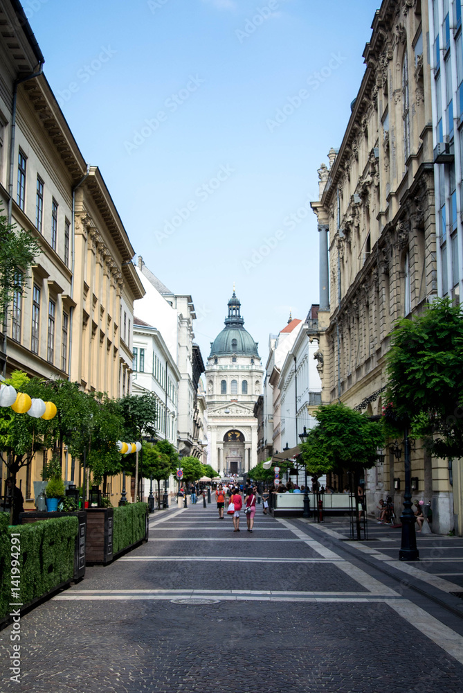 BUDAPEST, HUNGARY - JULY 24, 2016: A street of Budapest and St. Stephen's (Szent Istvan) Basilica, Hungary.