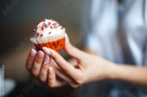 Beautiful cupcake in a woman's hand