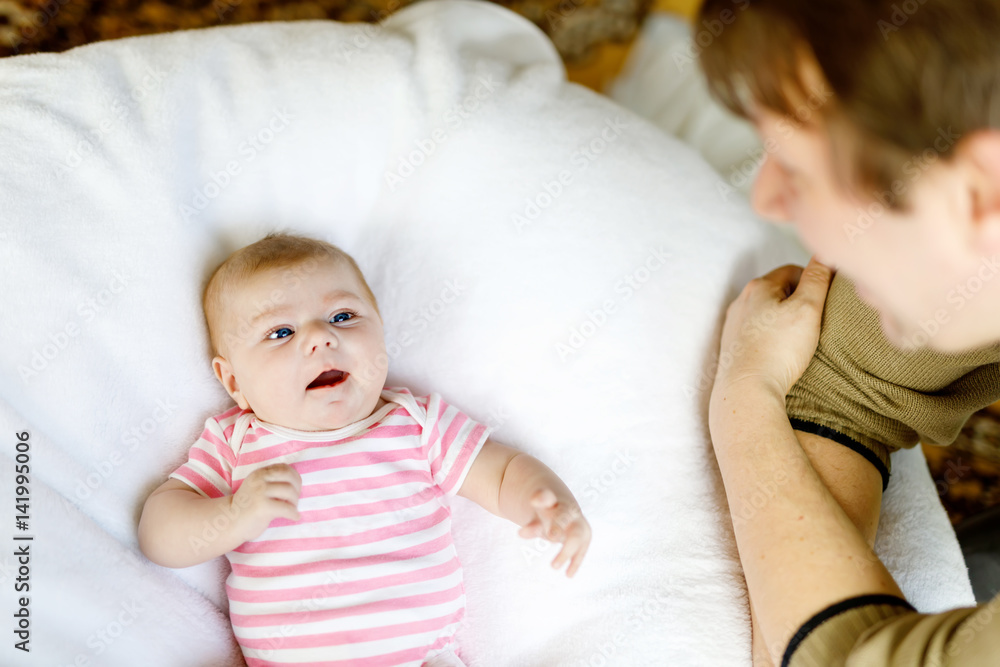 Happy proud young father with newborn baby daughter, family portrait togehter Happy proud young father with newborn baby daughter, family portrait togehter