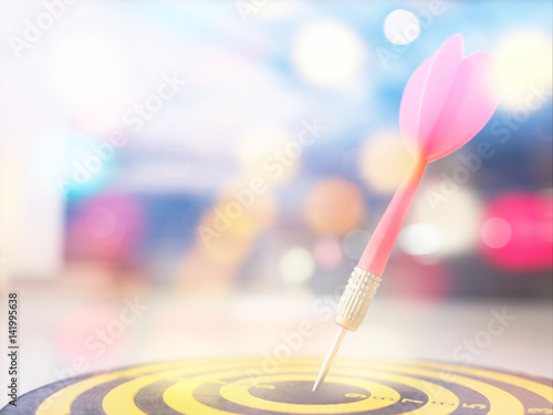 Target marketing concept, dart and arrow with blurred focus for business success background