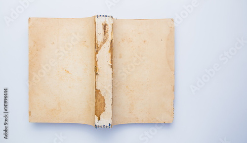 Old yellow book without cover isolated on white background