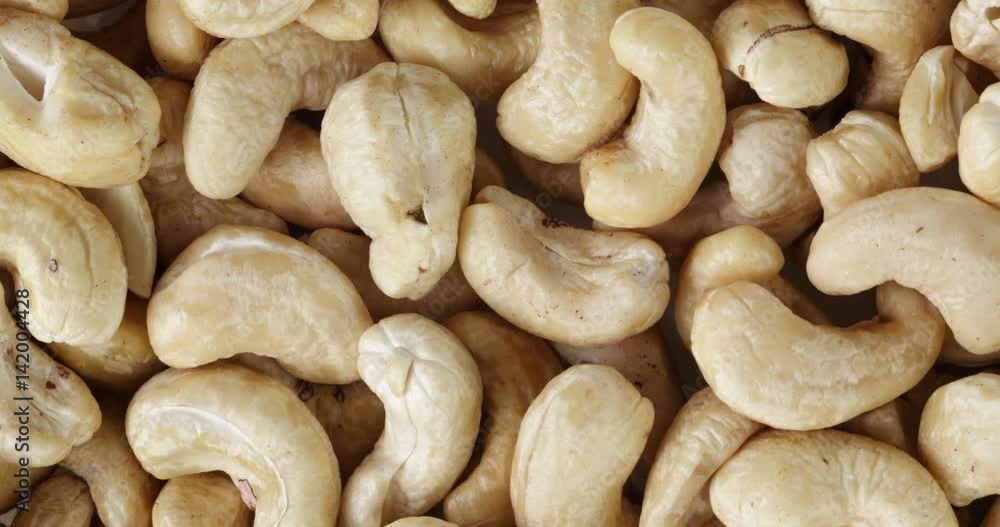 closeup pan of dried cashews nuts background, 4k prores footage closeup pan of dried cashews nuts background, 4k prores footage
