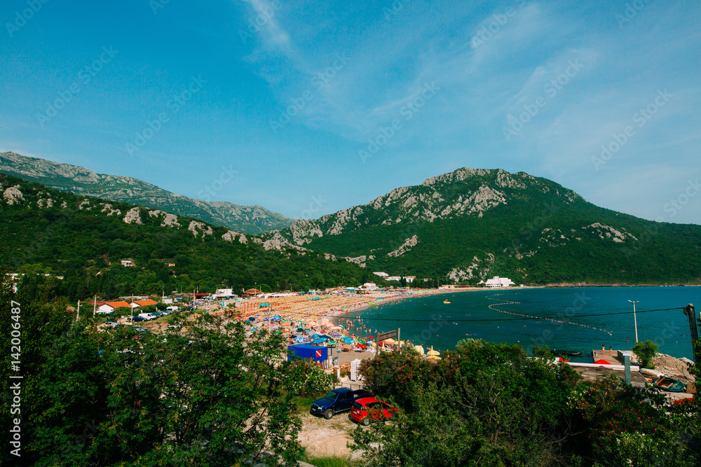 The beach and the promenade of the city of Canj in Montenegro