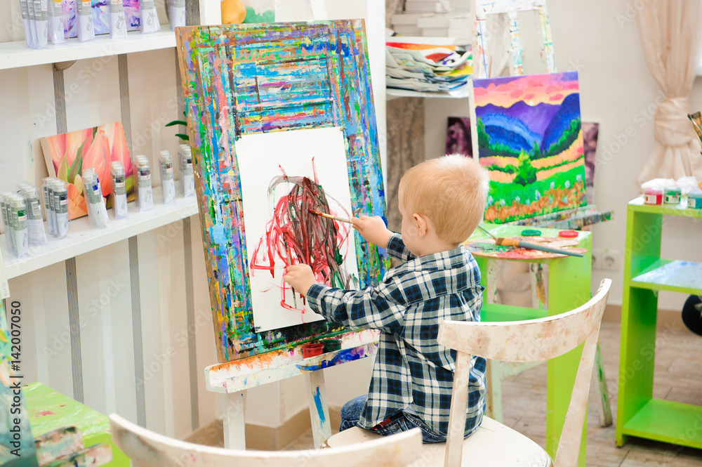 a child draws a picture paints on art lesson a child draws a picture paints on art lesson
