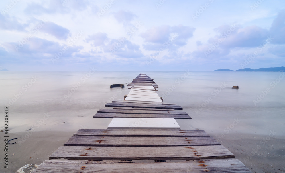 Bridge on beach in sunrise and sea wave in Rayong, Thailand