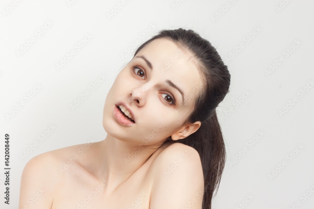 a pretty woman with her naked shoulders tilted her head to the side a pretty woman with her naked shoulders tilted her head to the side