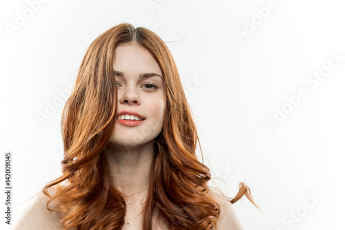 wavy hair, elegant woman on a light background