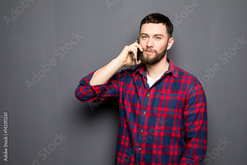 Handsome man speak phone wear shirt jeans