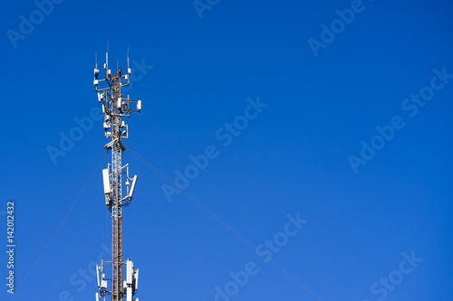 the cell tower operator on the blue sky