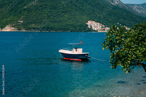 Wooden boats on the water. In the Bay of Kotor in Montenegro. Marine boats. © Nadtochiy