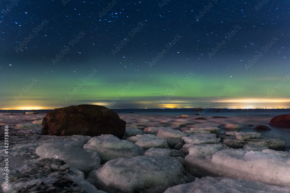 Obraz premium Aurora borealis. Northern Lights. Polar lights and ice floes. Ladoga. Russia St. Petersburg.