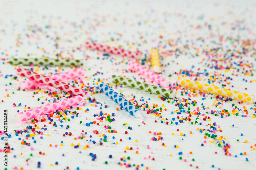 colorful birthday candles and candy sprinkles