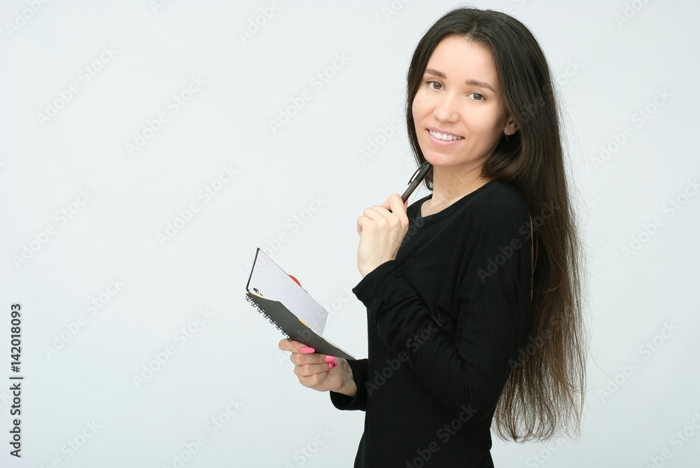 woman records by pen in notepad isolated on white background. woman records by pen in notepad isolated on white background.
