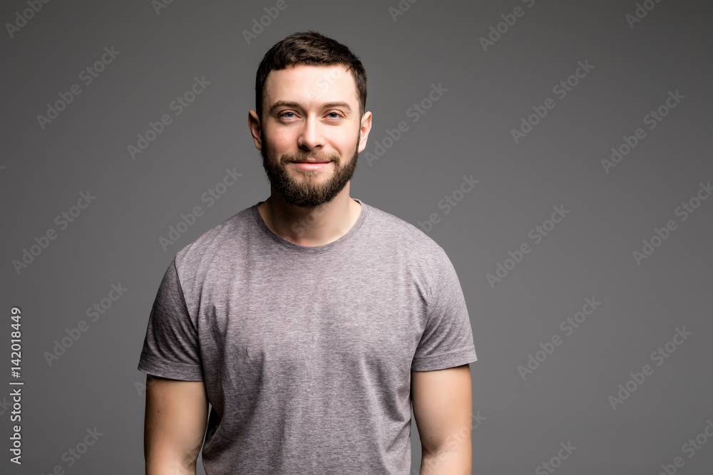 Portrait of a smart serious young man in casual clothes standing Portrait of a smart serious young man in casual clothes standing